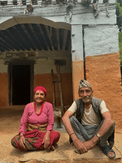 On the left, the couple who saved us by offering water. On the right, us, tired and sweaty, trying to catch our breath while sitting at a bus stop on our way back from the field