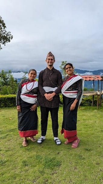 On the left, Didi, and Sunita (another local volunteer) are dressed in traditional clothes. On the right, is the slaughter of a buffalo on the path to the field.