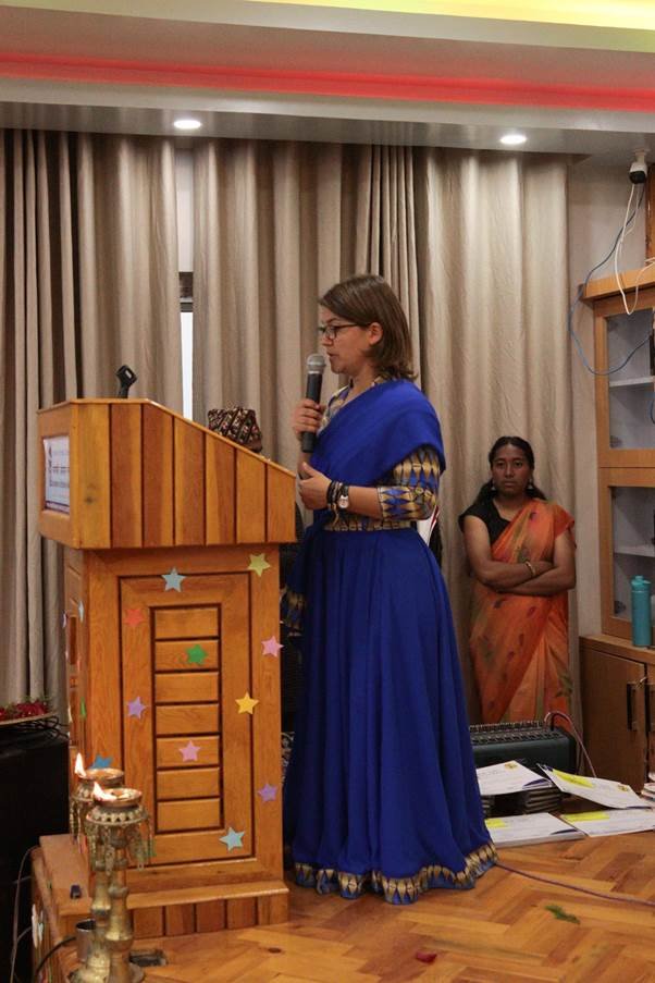 Eszter Boros grabs the microphone to announce the winners of the Nature Journaling Exhibition